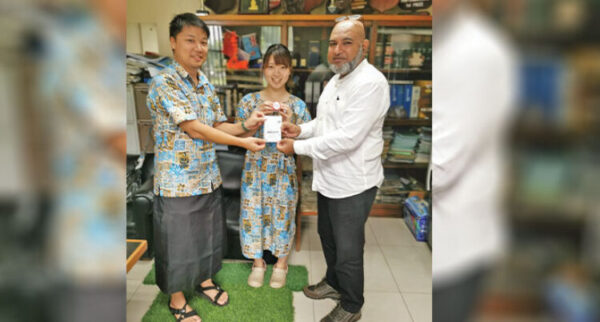 From left: Social Innovation Fiji Founder Akifumi Kawakami, Social Innovation Fiji member Kaeoko Suenaga and Lautoka City Council Chief Executive officer Mohammed Anees Khan hold up a Arigato Earth project stamp card on February 21,2023.